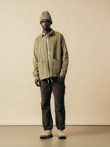 A model wearing layered winter clothing from menswear brand KESTIN