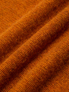 An orange Shetland lambswool fabric, made in Scotland. 