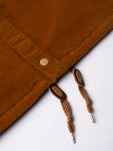 A close-up of the drawstring of the KESTIN Armadale Coach Jacket in brown moleskin.