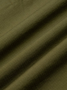 A green cotton ripstop fabric used by menswear clothing brand KESTIN.