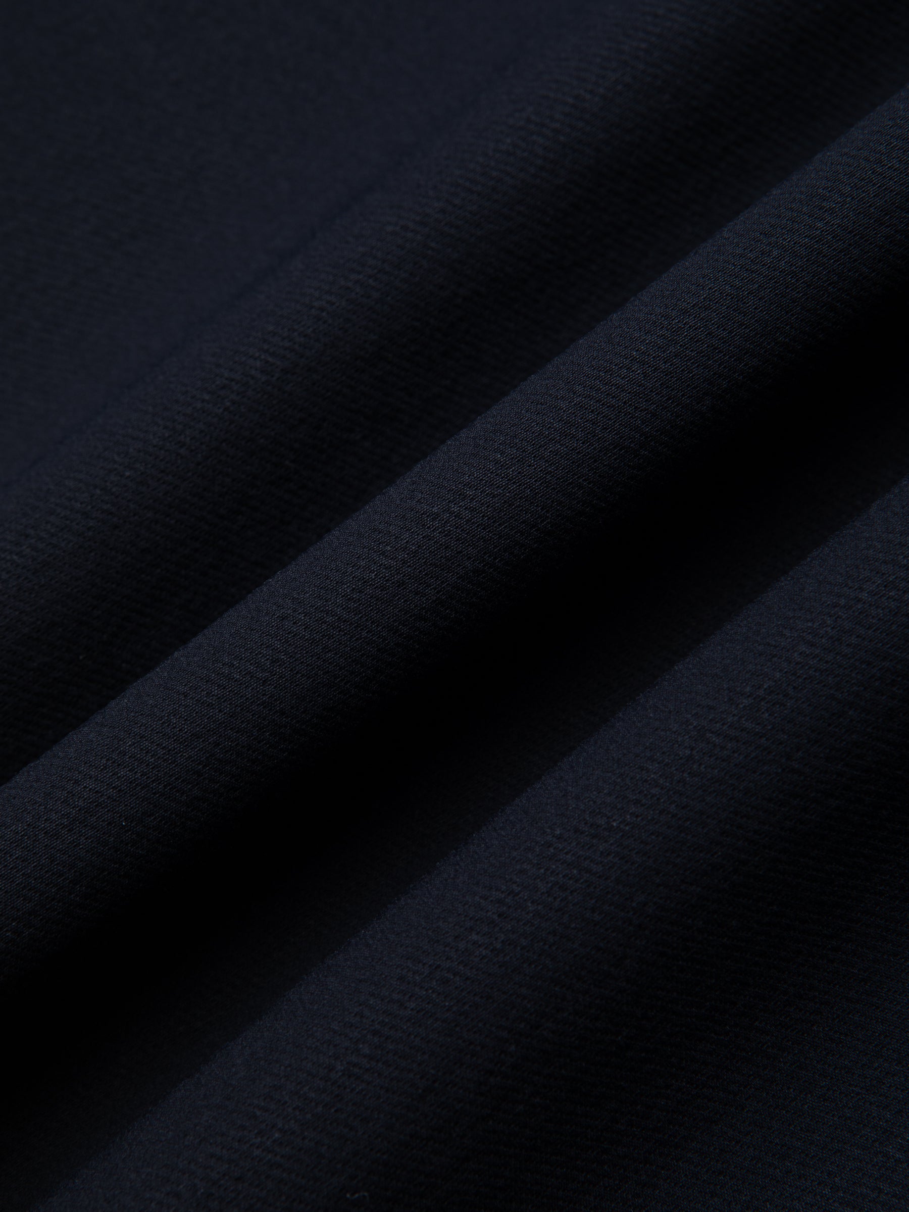 A navy blue Japanese CORDURA fabric, used to make a men's suit.