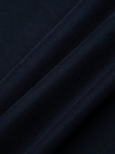 A dark navy blue twill fabric, used to make trousers by menswear brand KESTIN.