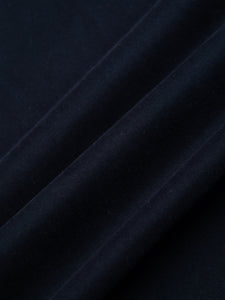 A navy blue cotton twill fabric, used to make a casual men's suit.