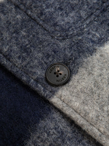 The logo detail to the button of the KESTIN Ormiston Jacket in Navy Check.