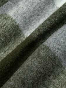 A green check Italian wool fleece fabric, used to make jackets and blankets.