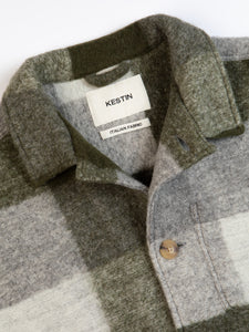 The buttoned front and collar of the KESTIN Ormiston Jacket in green check.