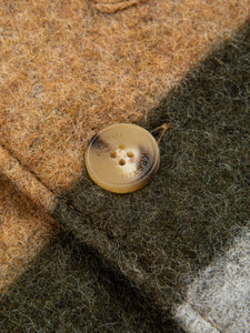 The button and logo detailing on the KESTIN Ormiston Wool Jacket.