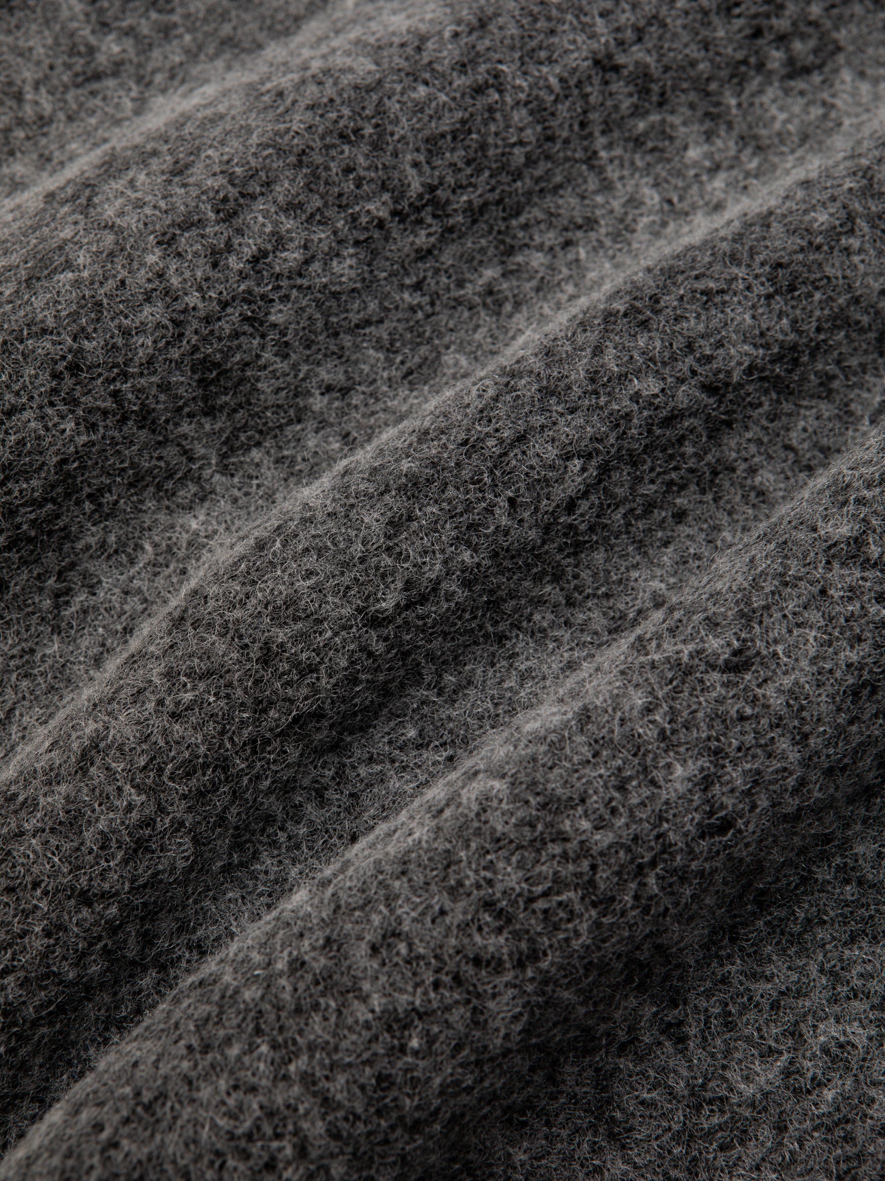 A grey wool fleece fabric used by KESTIN to make winter jackets.