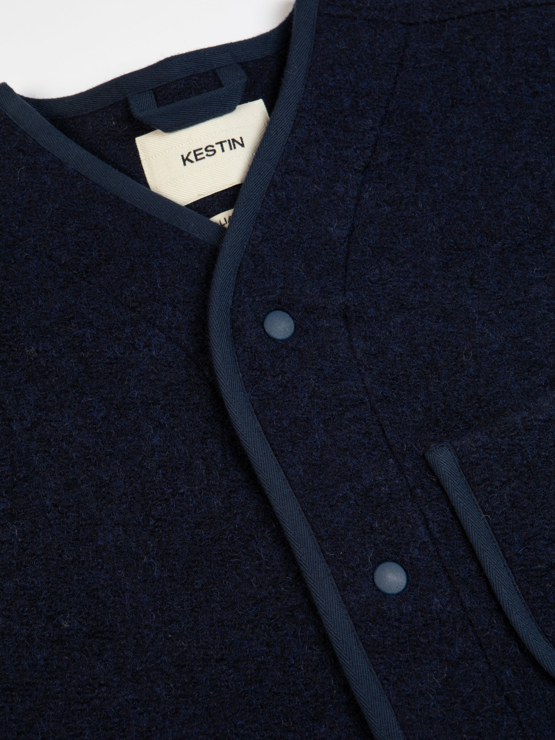 The snap-up front to the KESTIN Neist Fleece in blue.