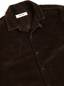 A brown overshirt from menswear brand KESTIN with an open collar.