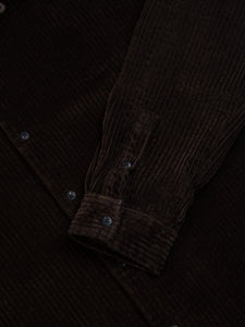 The buttoned cuff of the KESTIN Tain Overshirt in brown corduroy.