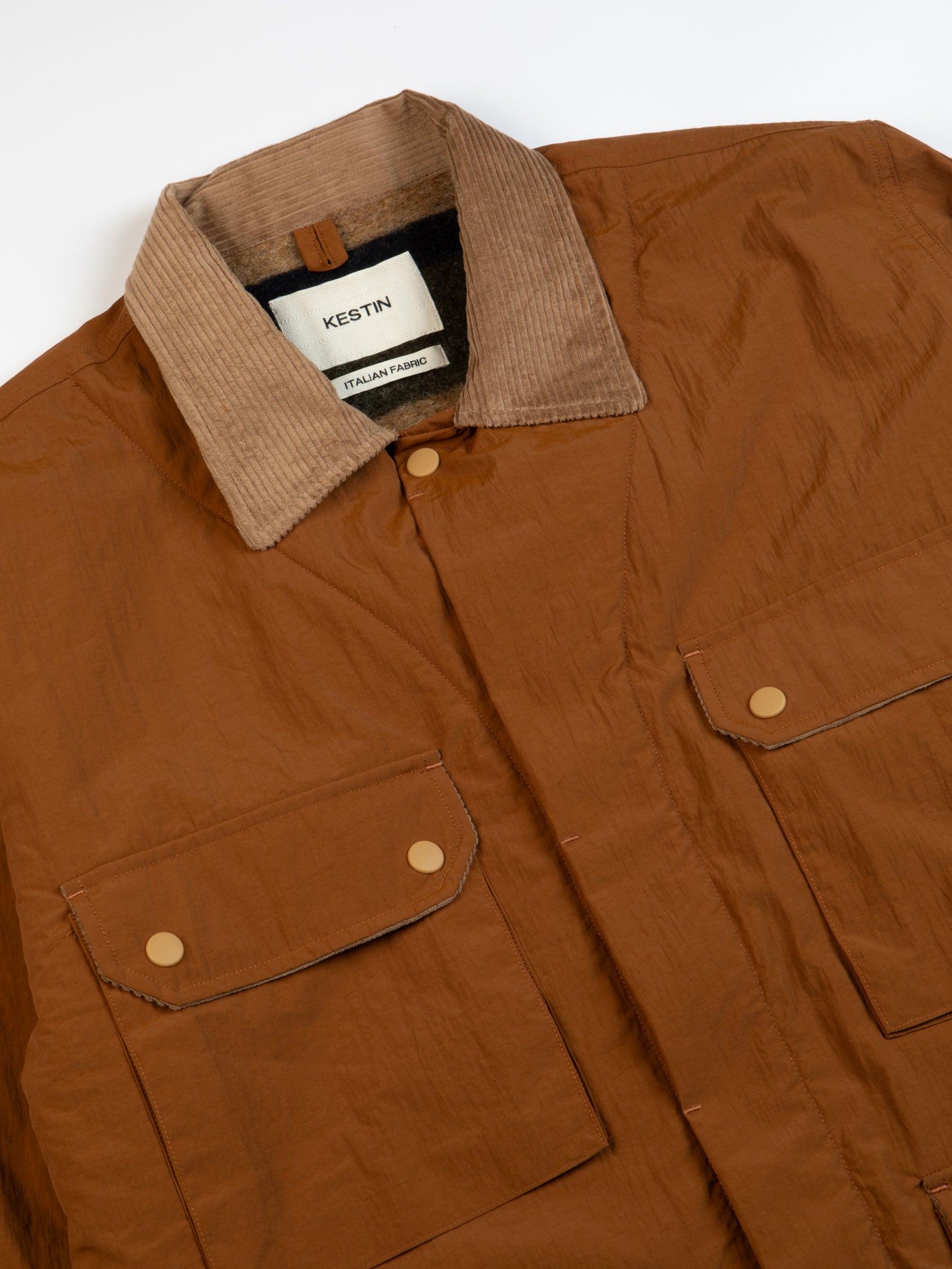 A jacket made from a brown Italian nylon and a corduroy collar.