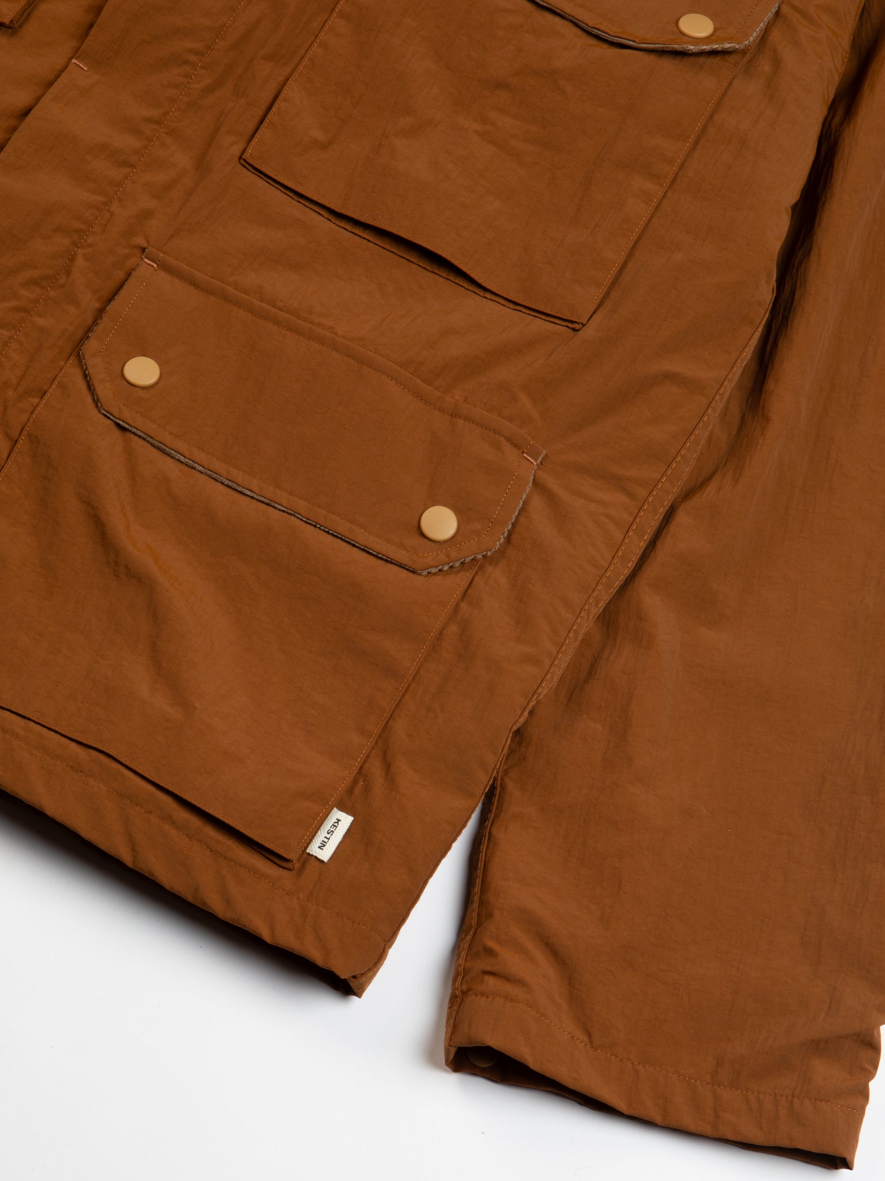 The hem detail of the KESTIN Strathblane Jacket in brown.