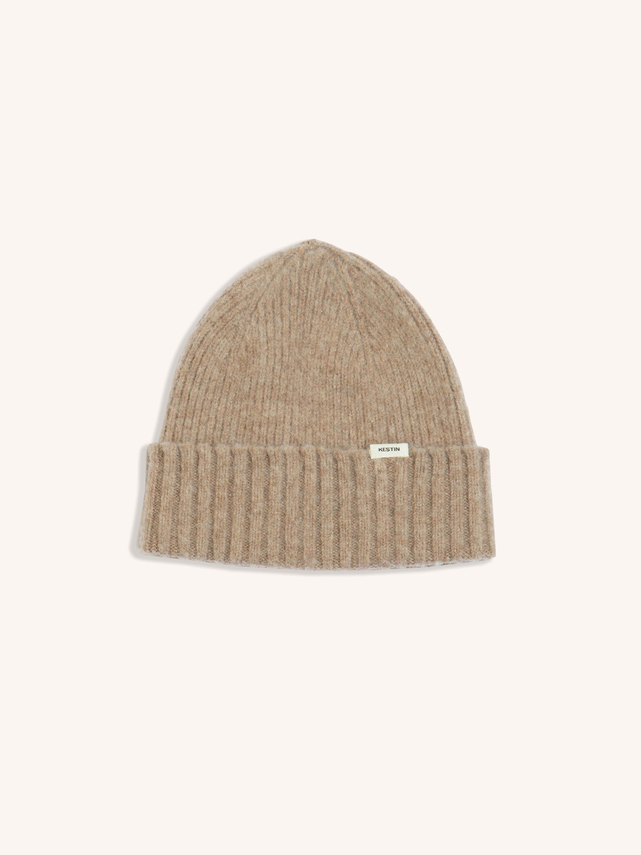 A beige beanie made from lambswool, on a white background