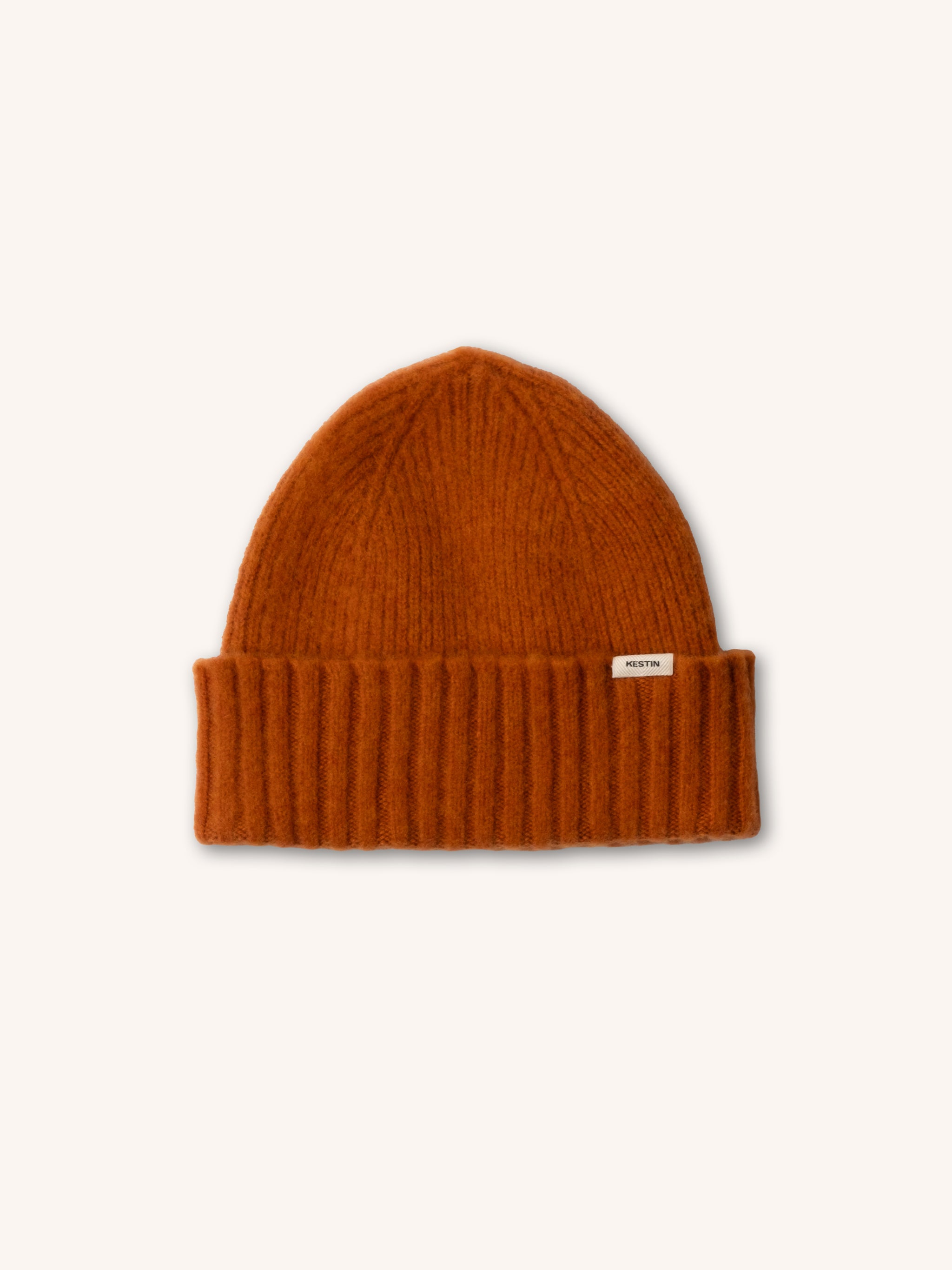 An orange lambswool beanie from Scottish menswear designer KESTIN.