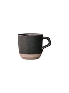 A black clay mug from Japanese brand KINTO, on a white background.