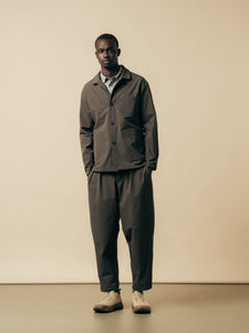 A model wearing a casual grey suit, made from a technical Japanese fabric.