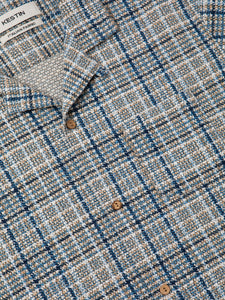 A close-up of the front of the KESTIN Crammond Shirt in a printed blue check.