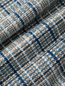 A close-up of a premium Italian woven fabric, with a printed check.