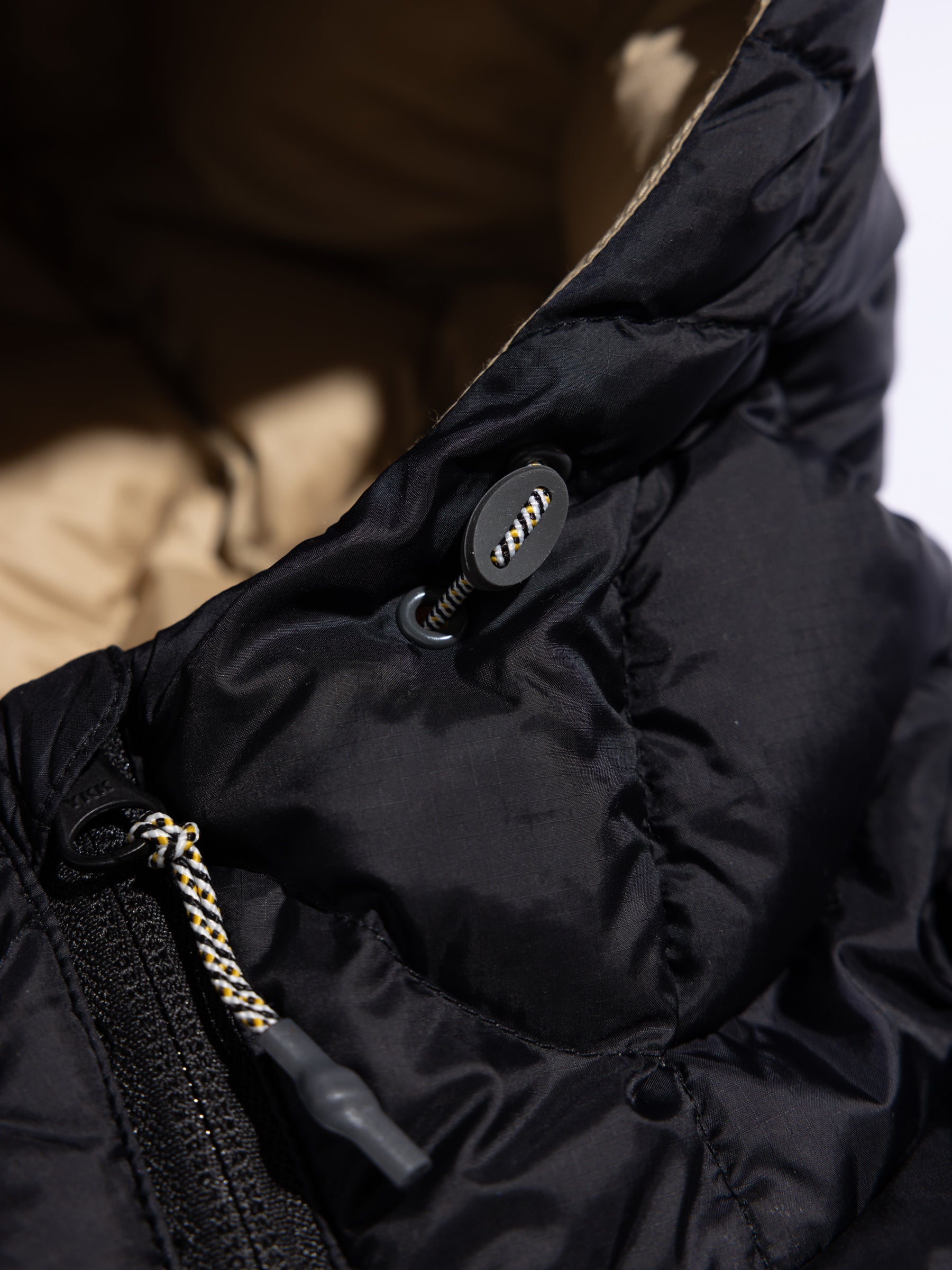 The adjustable drawcord through the hood of the KESTIN Cuillin Down Jacket.