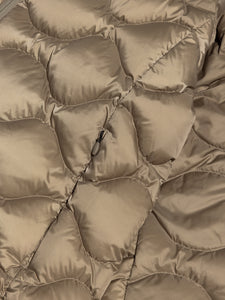 A light olive down jacket with 600 fill power and an onion quilt construction.