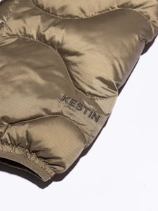 The embroidered logo to the cuff of a down jacket from menswear brand KESTIN.