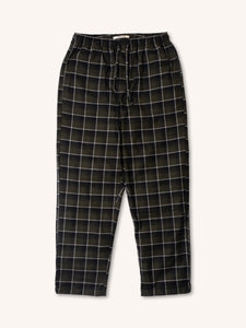 A pair of men's check pyjama trousers in green, on a white background.