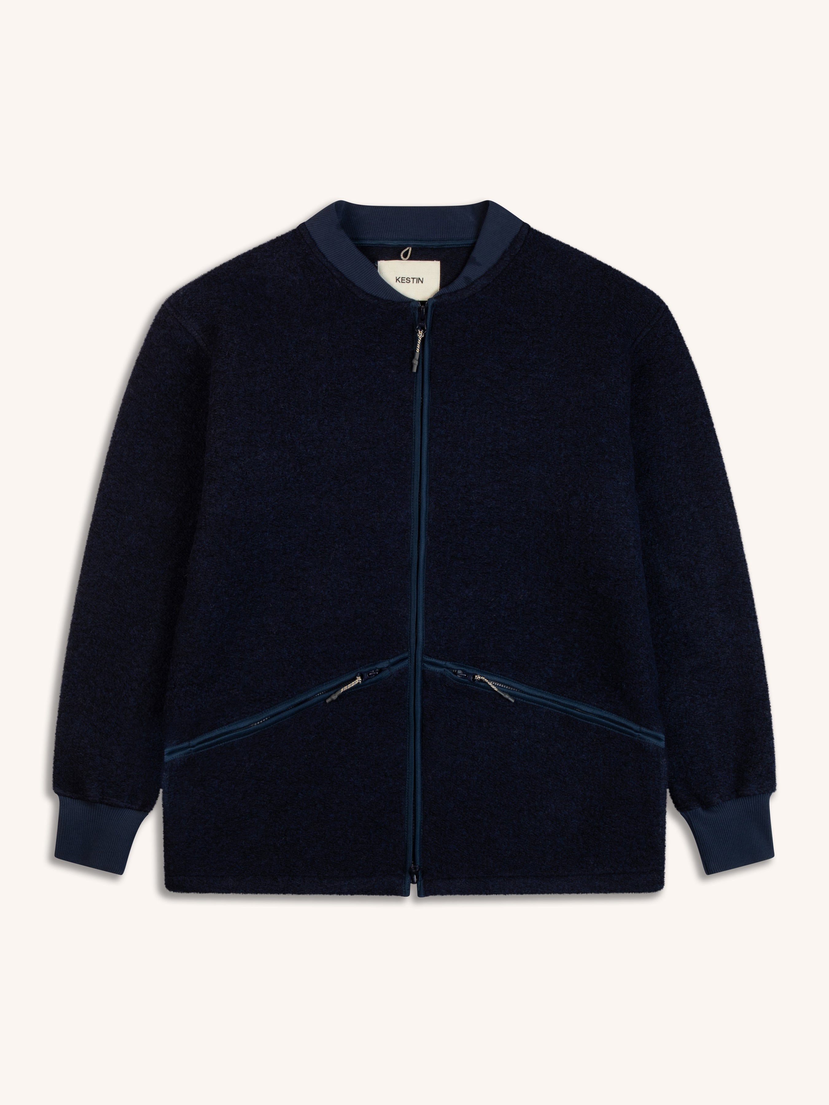 A navy blue fleece from menswear brand KESTIN, on a white background.