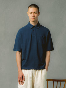 A model wearing a relaxed fit polo shirt from menswear brand KESTIN.