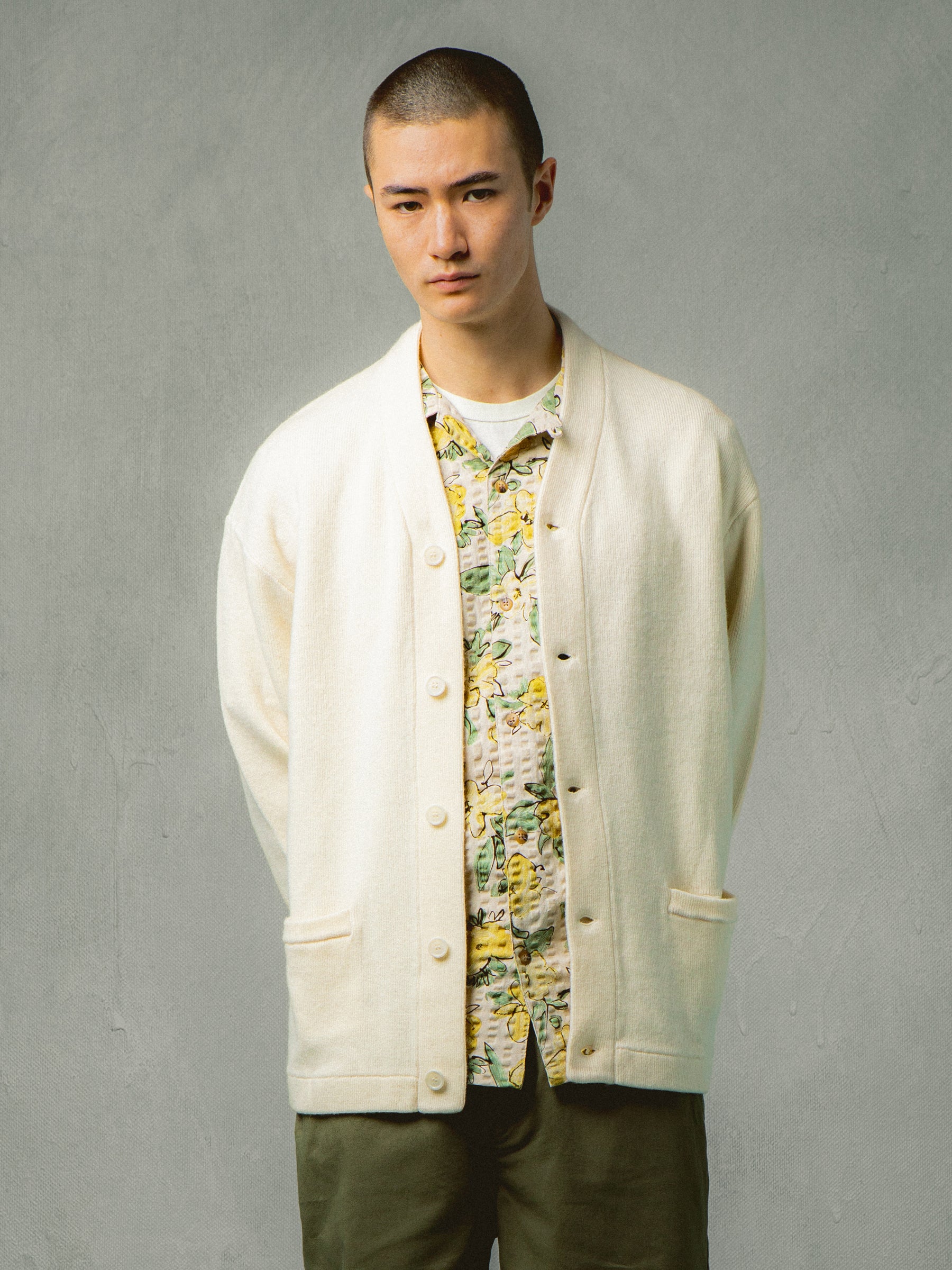 A model wearing a floral shirt and cardigan from Scottish menswear brand KESTIN.