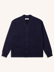 A navy blue cardigan from Scottish menswear brand KESTIN, on a white background.