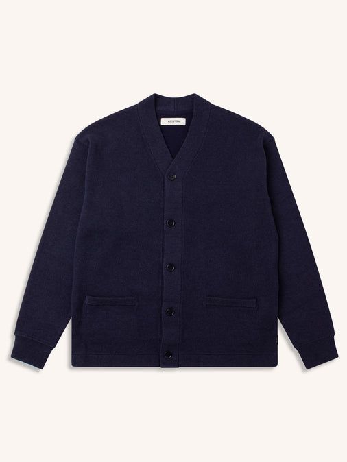 A navy blue cardigan from Scottish menswear brand KESTIN, on a white background.