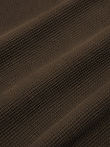 A brown waffle fabric, used to make the KESTIN Humbie Sweatshirt.