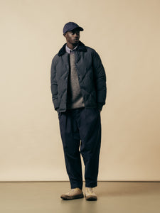 A model wearing a layered winter outfit from Scottish designer brand KESTIN.