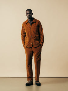 A man wearing a brown moleskin suit, from menswear designer KESTIN.