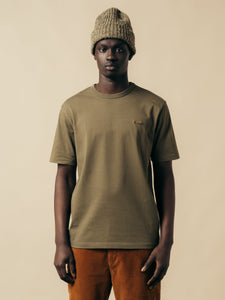 A model wearing a short sleeve t-shirt from Scottish designer KESTIN.