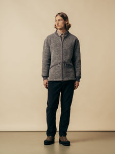 A model wearing a grey fleece from Scottish menswear brand KESTIN.