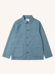 A men's blue chore coat from menswear brand KESTIN, on a white background.