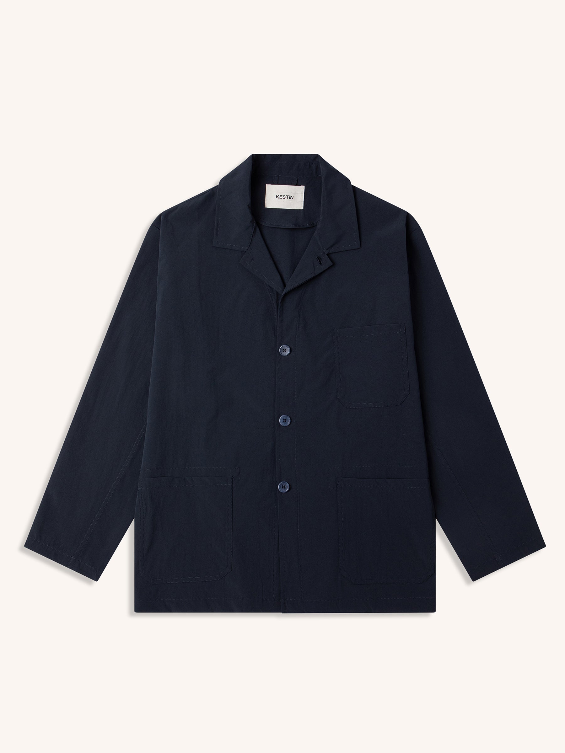 A technical navy blue blazer from menswear designer brand KESTIN.