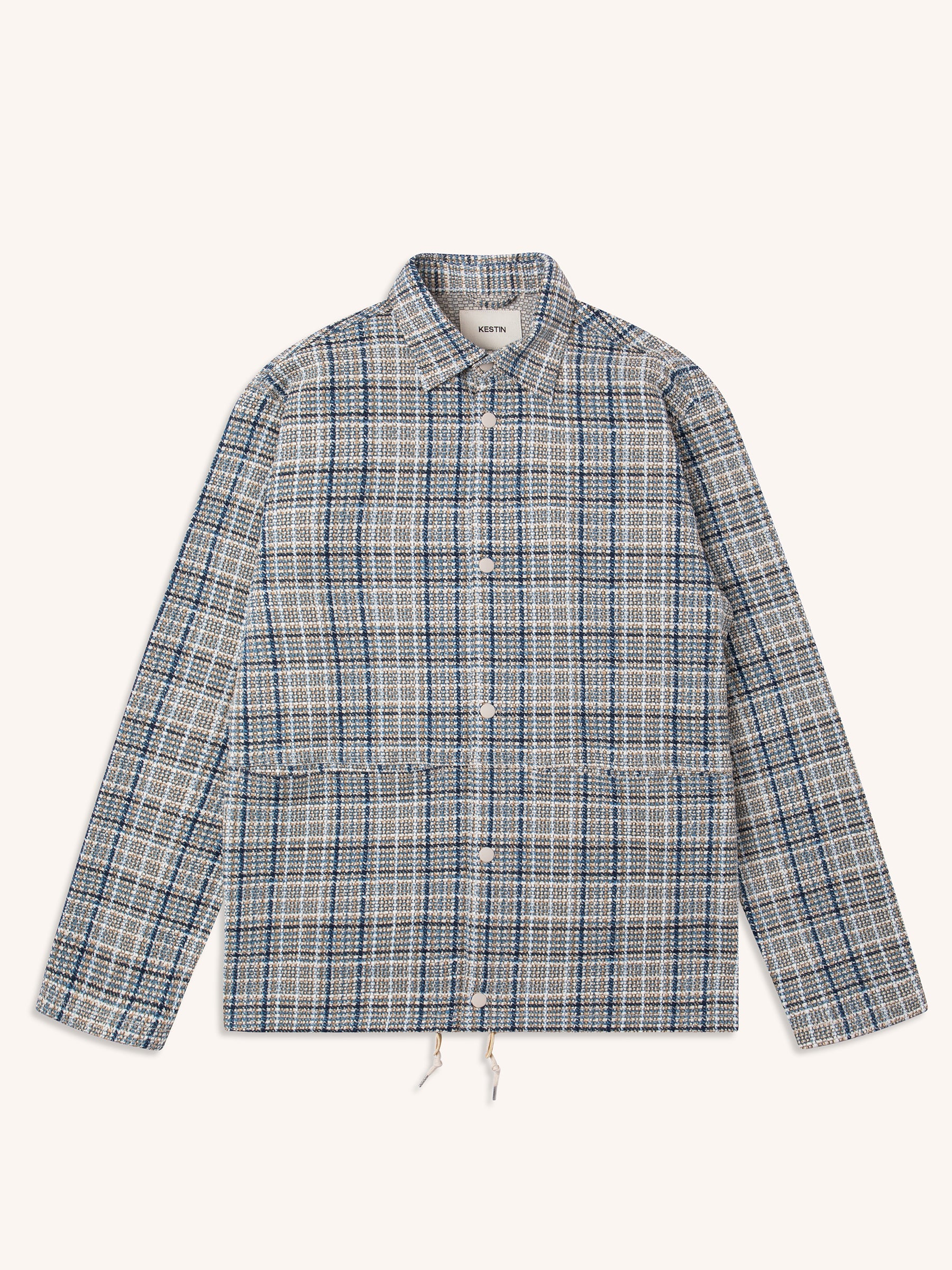 A woven check pattern coach jacket from menswear brand KESTIN, on a white background.