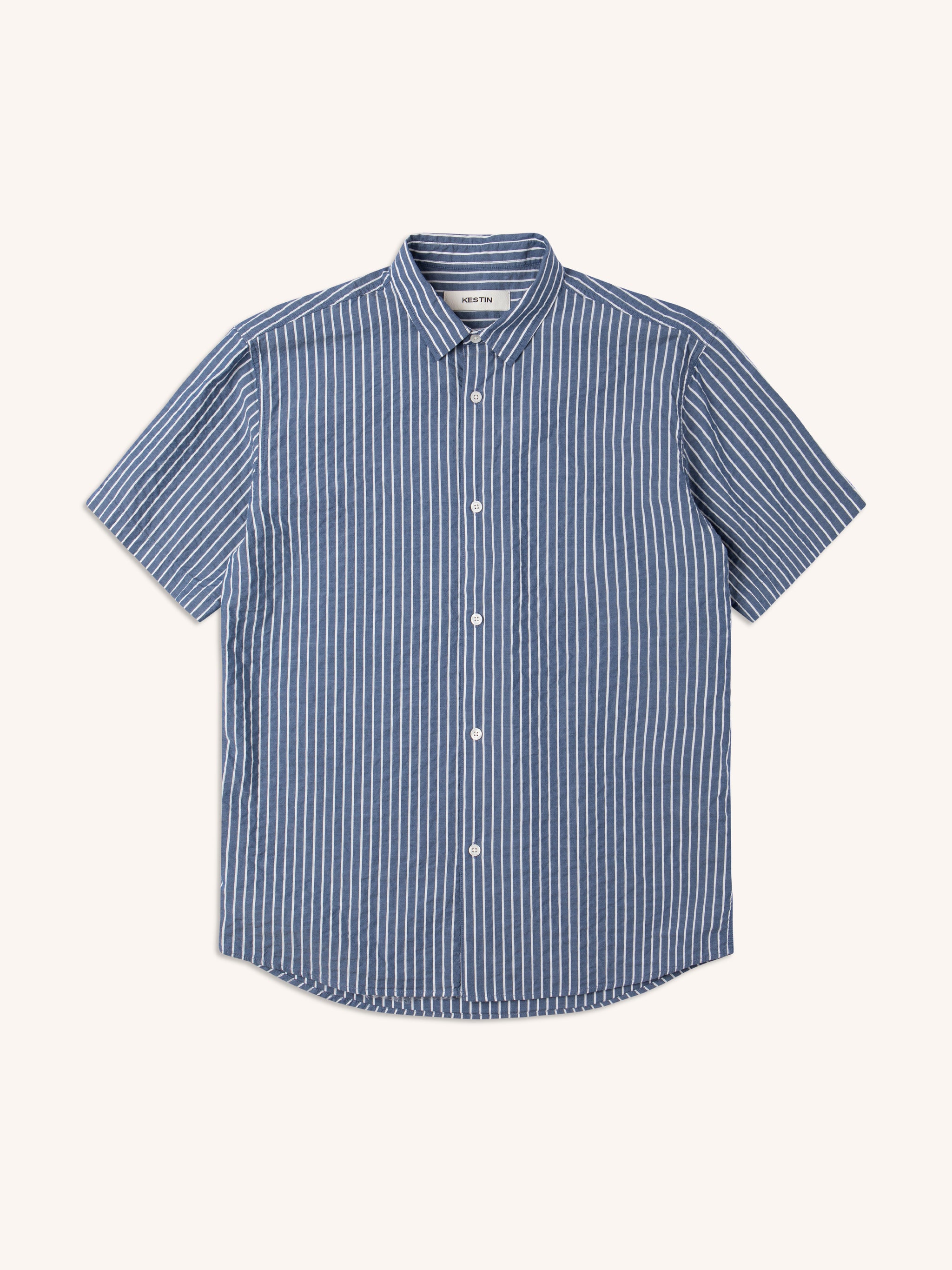 A men's short sleeve shirt in a blue stripe fabric, on a white background.