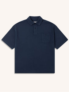 A short sleeve polo shirt in navy blue from KESTIN, on a white background.