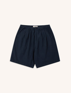 A pair of navy blue shorts in a casual textured weave, on a white background.