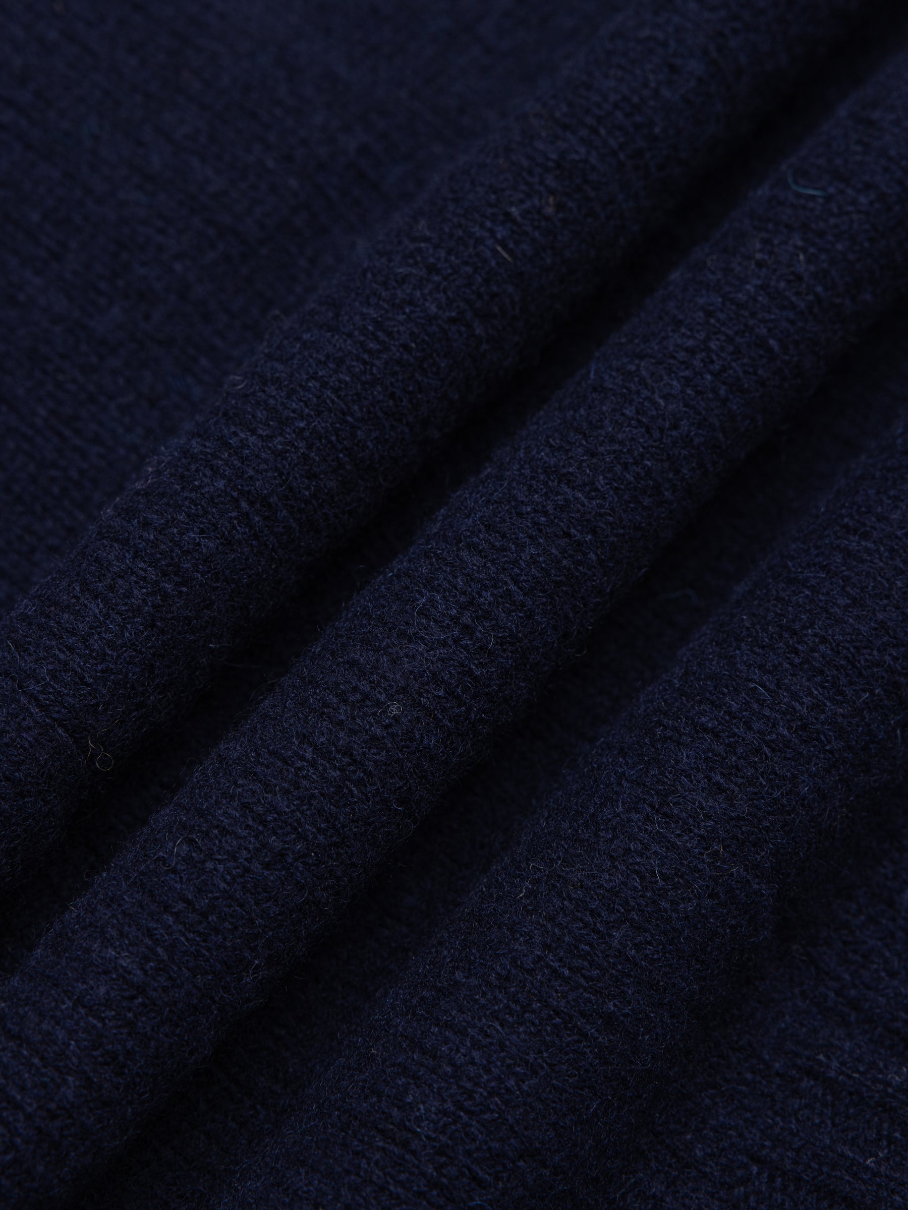 A navy blue shetland lambswool yarn, used to make Scottish knitwear.