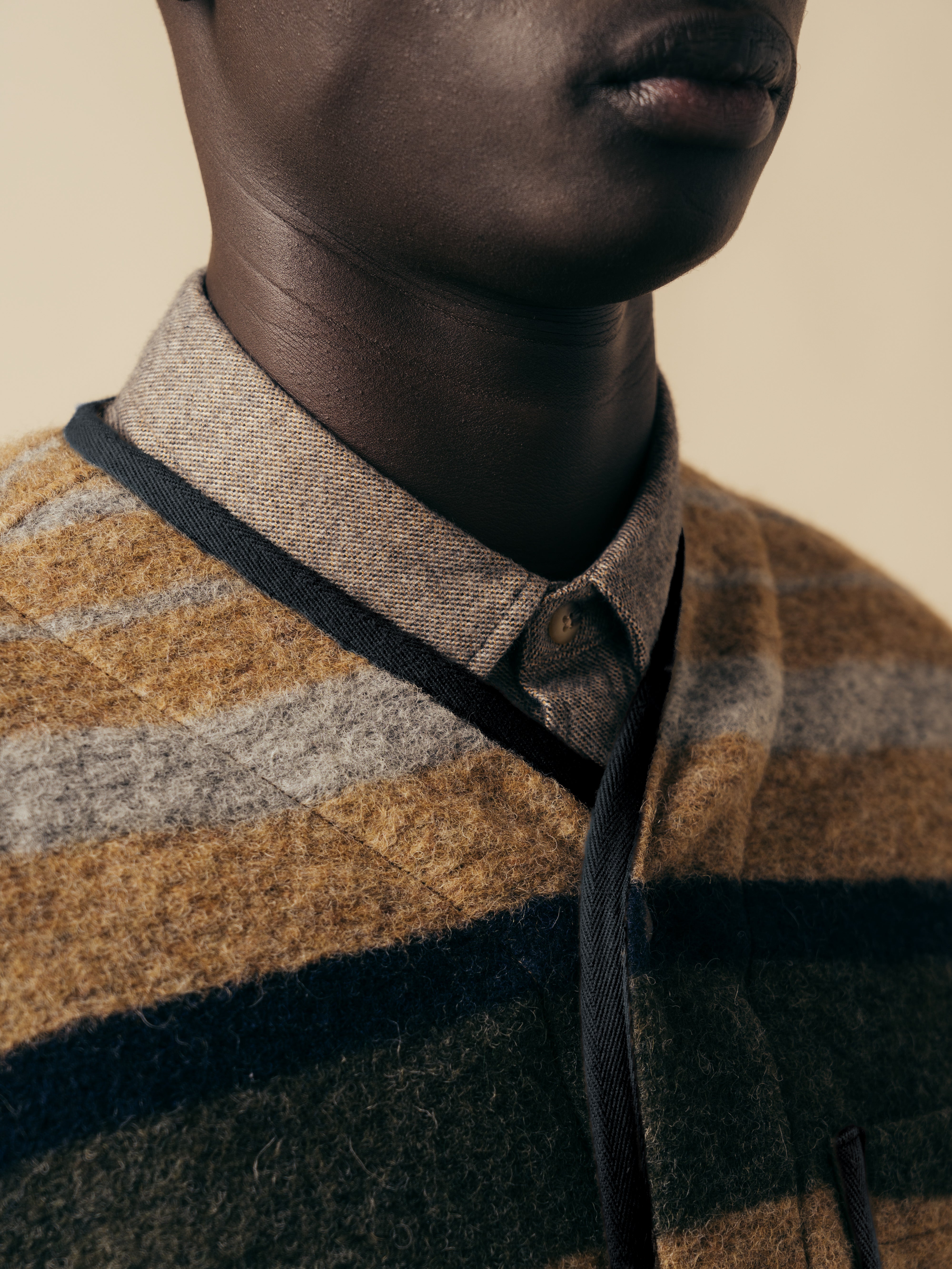 The snap-up front and v-neck of the KESTIN Neist Cardigan in stripe.