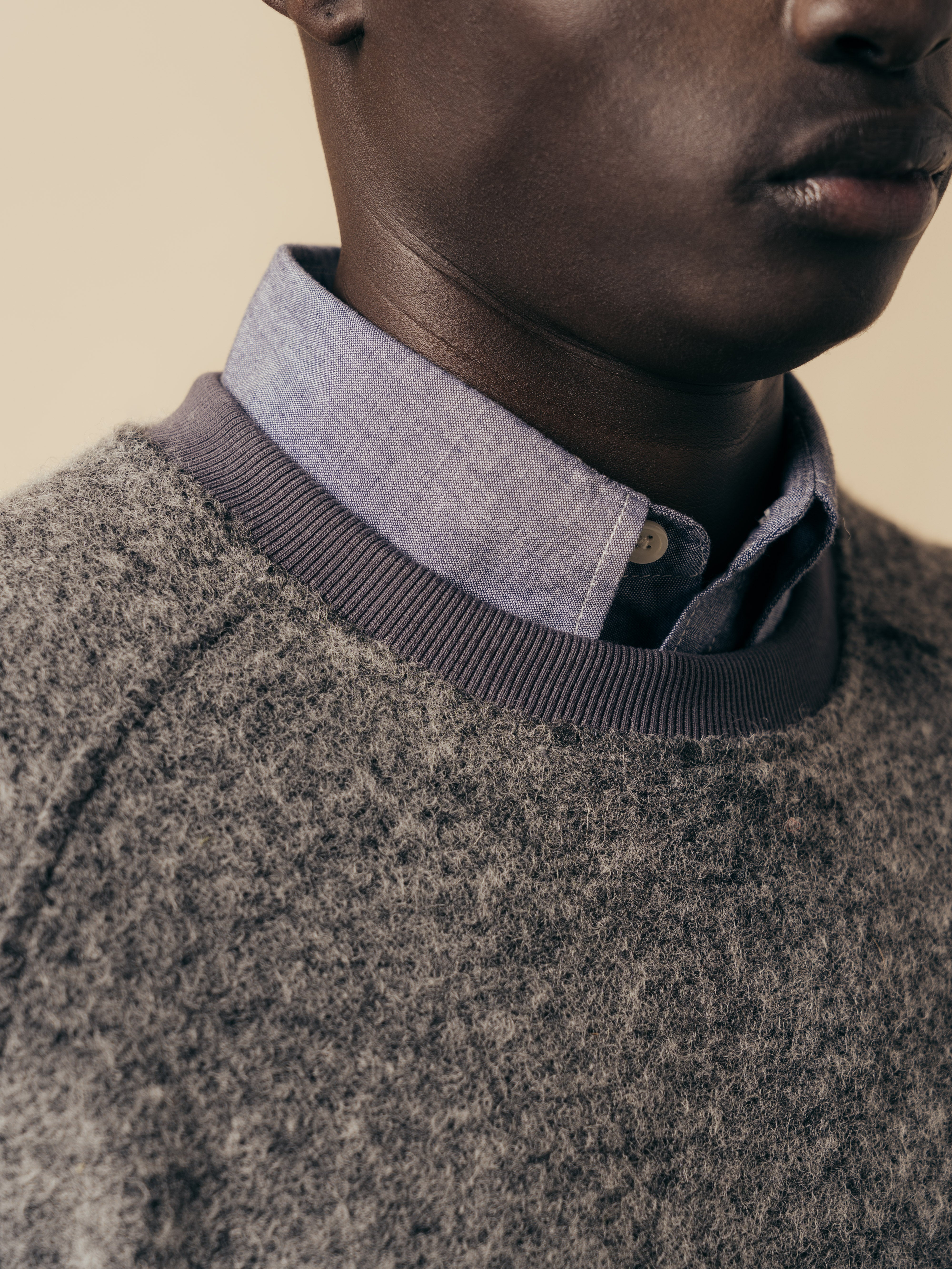 The ribbed crew neck of the KESTIN Junction Sweat, with a shirt collar underneath.