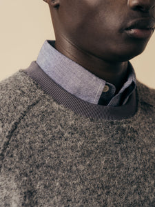 The ribbed crew neck of the KESTIN Junction Sweat, with a shirt collar underneath.