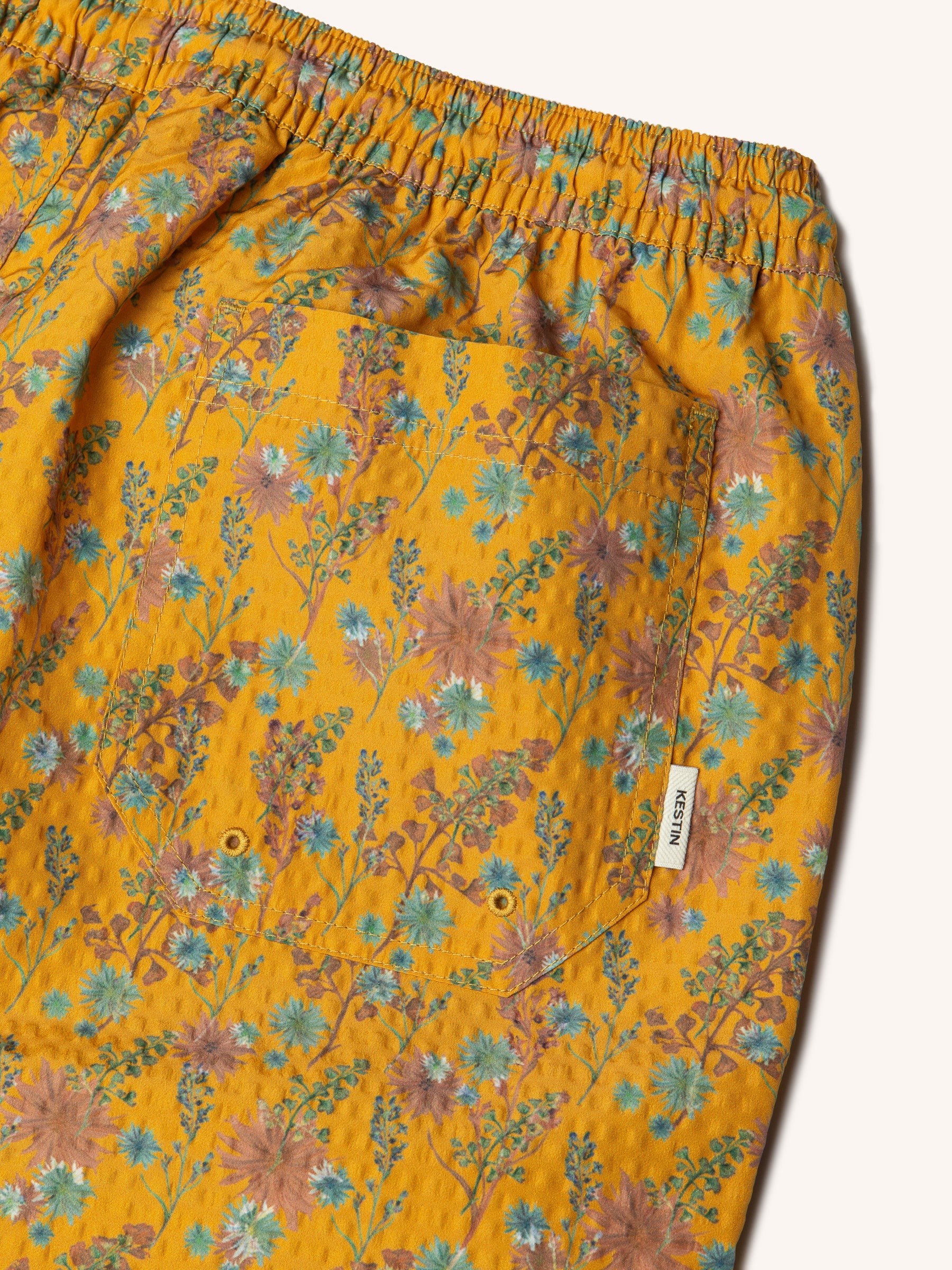 The back of the Seacliff Shorts from menswear brand Kestin, in Ochre Thistle Print.