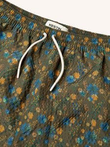 The front of the KESTIN Seacliff Swimming Shorts in Olive Thistle Floral Print.