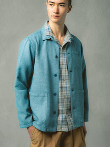 A model wearing a casual blue jacket from Scottish menswear designer KESTIN.